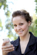 Young Attractive Businesswoman Texting On the Phone