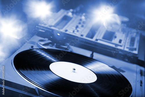 Photo: DJ Turntable with bright lights DJ Turntable with bright lights