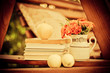 Books, fresh apples, and marigolds in a vase stock image