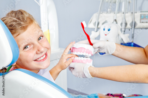 Photo: Happy child with toy dentures Happy child with toy dentures