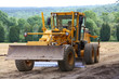 Véhicule niveleuse chantier travaux publics