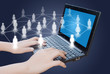 Hand pushing laptop keyboard with social network.