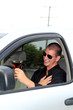 Man In Truck Holding Alcohol Causally Laughing