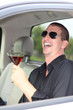 Man In Truck Holding Alcohol Laughing