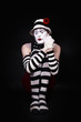 Mime in a white hat