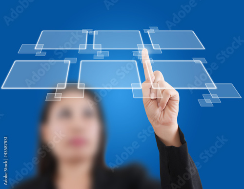 Photo: Business lady pushing button on the whiteboard. Business lady pushing button on the whiteboard.