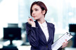Photo: Business women in modern glass interior Business women in modern glass interior