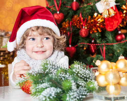Photo: Happy child in Santa`s hat Happy child in Santa`s hat