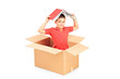 Foto: A child in a cardbox holding a book over his head A child in a cardbox holding a book over his head