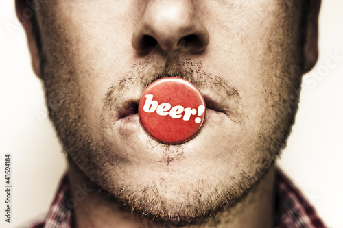 Photo: Face Of A Man With Beer Badge Face Of A Man With Beer Badge