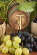 Foto: In oak casks with vines and grapes white and black In oak casks with vines and grapes white and black