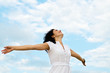 Happy woman with outspread arms