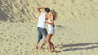 Video: Attractive couple dancing on the sand together Attractive couple dancing on the sand together