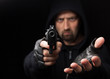 Robber with gun holding out hand