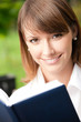 Businesswoman with notebook outdoors