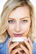 Attractive young woman drinking take away coffee