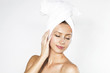 Attractive young blonde woman wearing a towel on her head