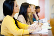 group of young college students in classroom