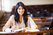 beautiful female indian college girl in lecture hall