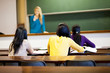 group of female college students in classroom with teacher