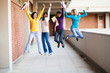 Foto: group of female college students jumping up group of female college students jumping up