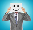Photo: businessman with smiling mask businessman with smiling mask