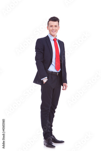 Photo: business man standing with hand in pocket business man standing with hand in pocket