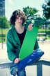 Photo: skater posing with his skateboard skater posing with his skateboard