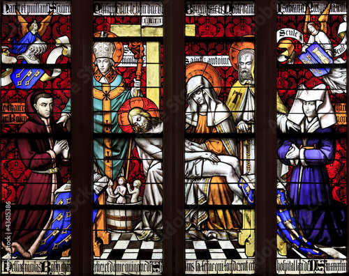 Photo: The stained glass window of Piety at hospice in Beaune The stained glass window of Piety at hospice in Beaune