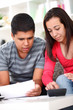 Photo: Lifestyle - young couple doing their accounting Lifestyle - young couple doing their accounting