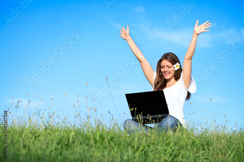 Photo: Happiness woman working with laptop, outdoor Happiness woman working with laptop, outdoor