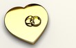cuore d'ore con fedi nuziali