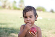 Photo: bambino fa la merenda con la frutta bambino fa la merenda con la frutta