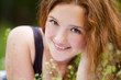 Portrait of young smiling redhaired girl