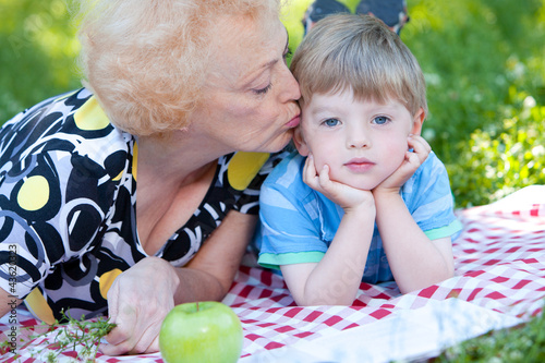 Photo: Grandmother kissing her grandson Grandmother kissing her grandson