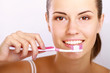 Photo: Woman with great teeth holding tooth-brush Woman with great teeth holding tooth-brush