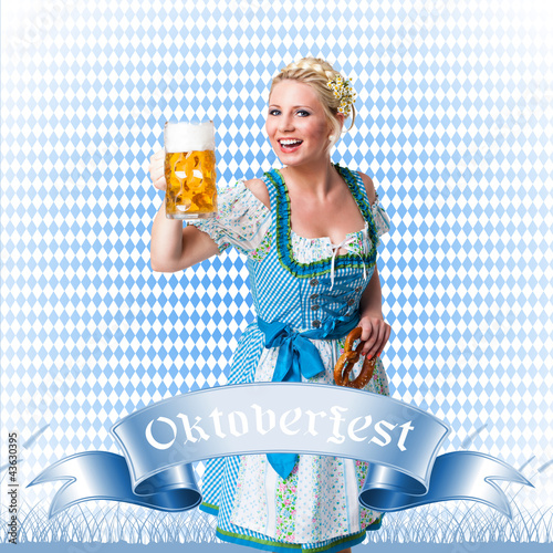 Photo: junge blonde Frau im Dirndl mit Masskrug und Brezn junge blonde Frau im Dirndl mit Masskrug und Brezn
