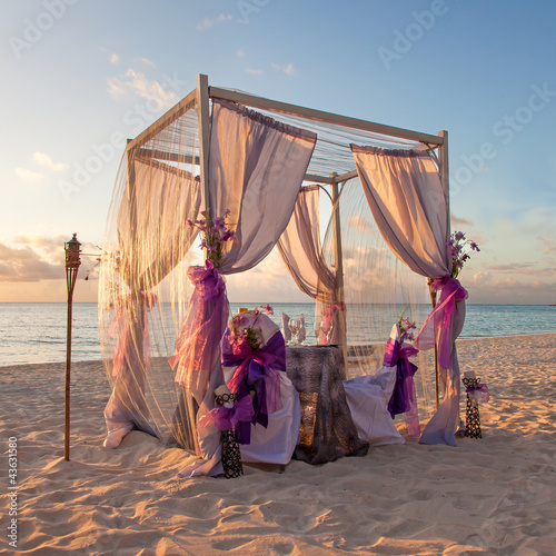 Photo: Romantic Wedding Table on Sandy Tropical Caribbean Beach at Suns Romantic Wedding Table on Sandy Tropical Caribbean Beach at Suns