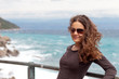 Photo: Young woman by the beach Young woman by the beach