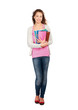 A smiling female student holding books