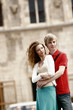 A guy hugging his girlfriend from the back