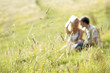 A couple sitting together on the prairie