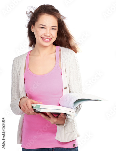 Photo: A smiling female student holding books A smiling female student holding books