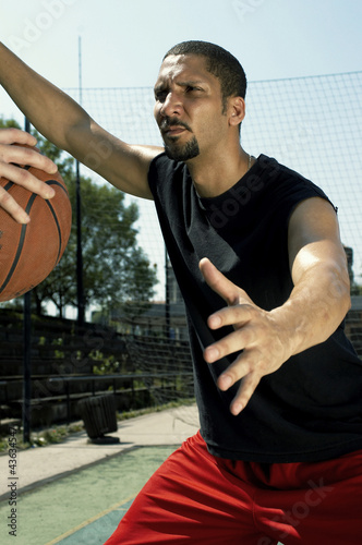 Photo: A man stopping his opponent from passing the ball A man stopping his opponent from passing the ball