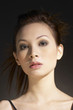 Studio shot of an attractive lady with makeup and hairdo