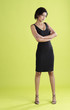 Studio shot of a lady in a knee-length dress