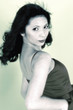 Black and white picture of a lady in dress looking at the camera