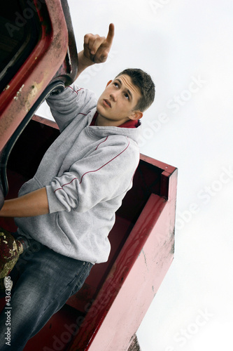 Photo: A boy pointing up A boy pointing up