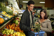 A couple shopping for fruits