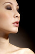 Close-up of a woman closing her eyes